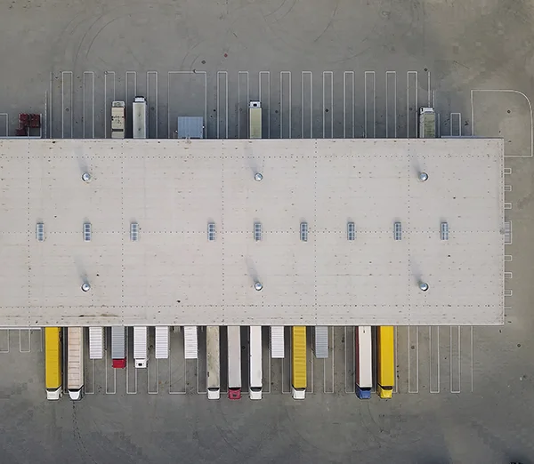 Aerial_warehouse_logistics_center_industrial_trucks_loading_600x522.jpg